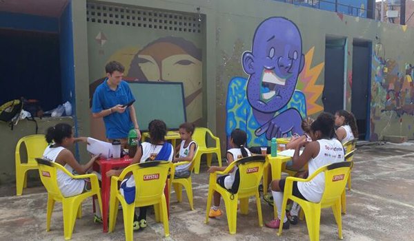 volunteer teaching to school kids