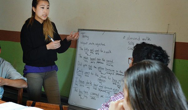 volunteer offering teaching class to local