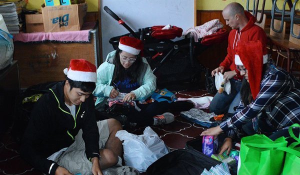 volunteer packaging gifts for child