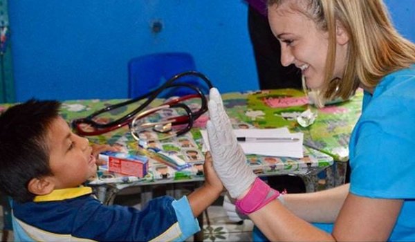 child giving a high five to doctor