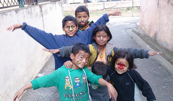 orphan child having fun time in nepal