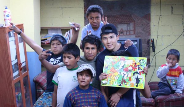 volunteer teaching drawing to child