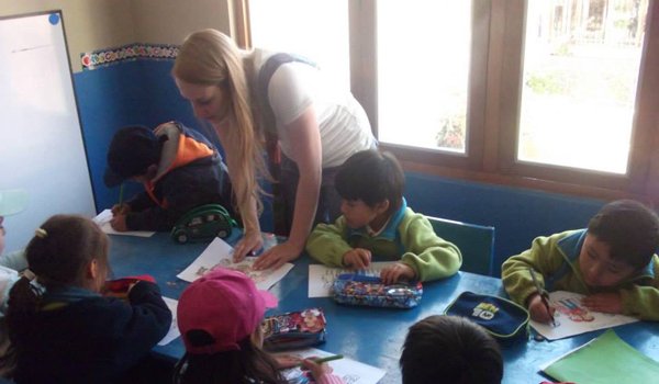 volunteer teaching to school kids