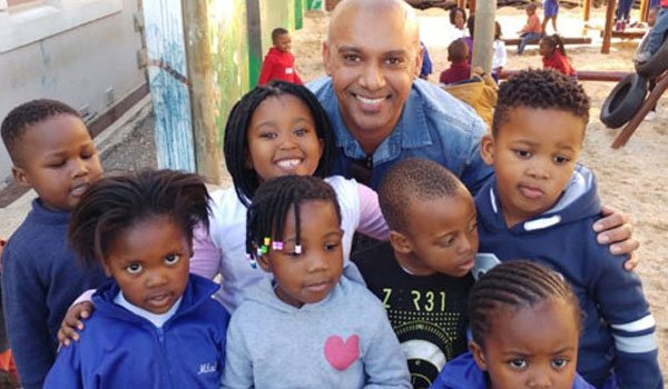 Happy children relishing with a volunteer